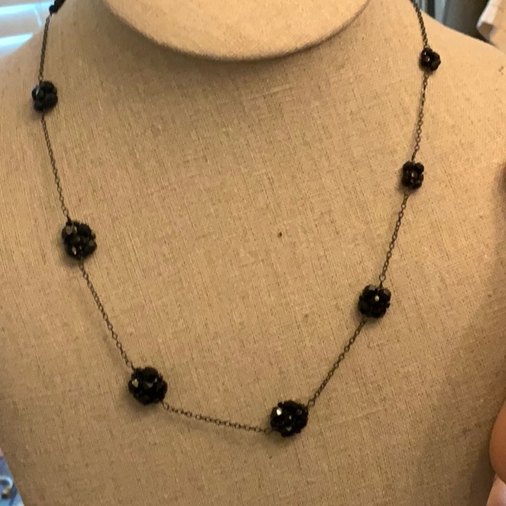 Black seed bead flowers on a delicate chain